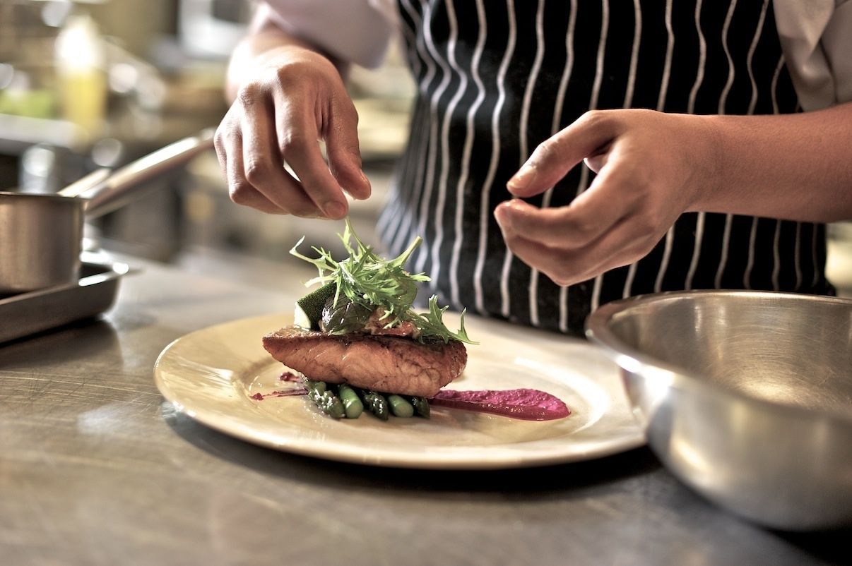 A chef plating in the lodge kitchen